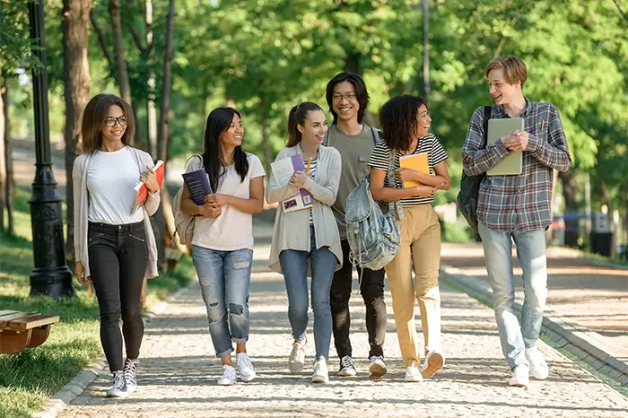 Group of students walking outside on campus