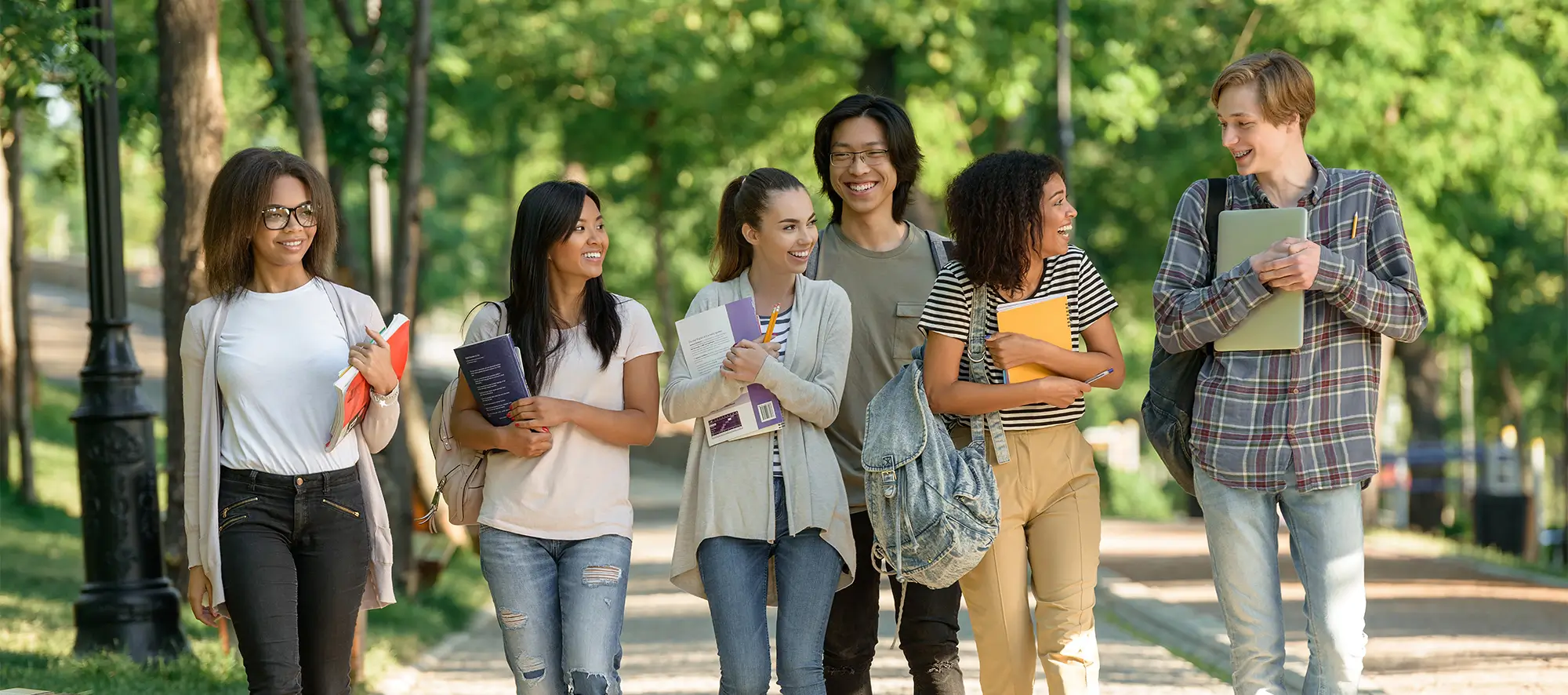 Group of students on campus walking outside.