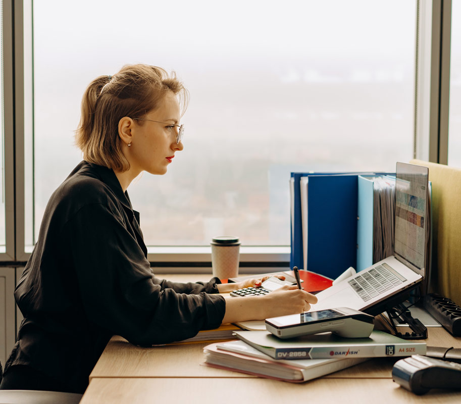 Female accountant working at a computer.