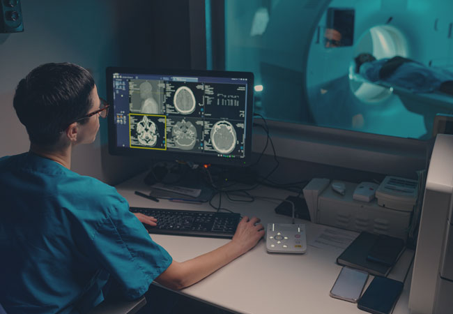 Medical person performing an MRI on a patient