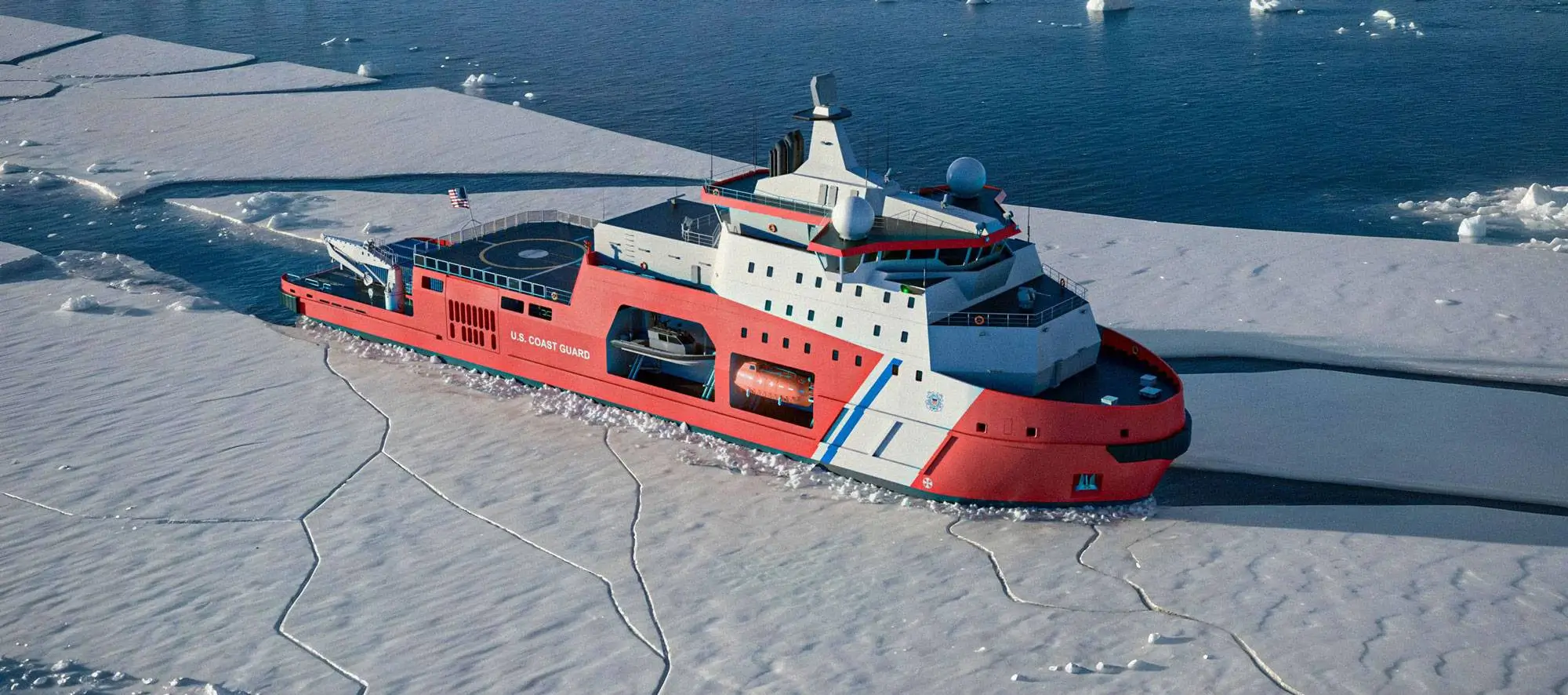 Coast Guard ship cutting through ice in the water.