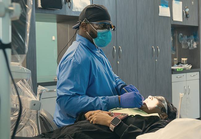 Dental student in clinic.