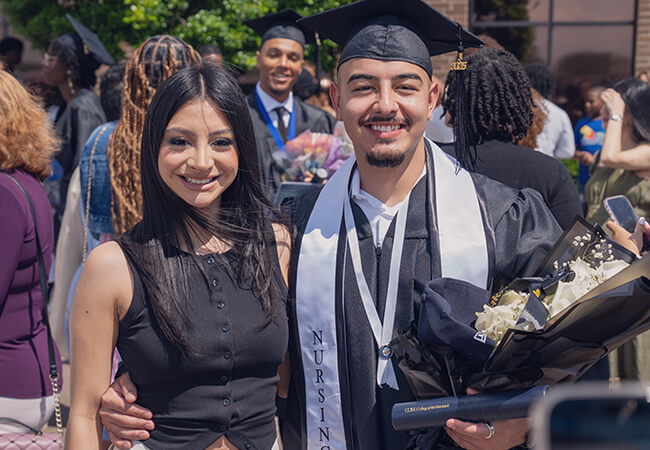 Graduates outside after commencement ceremony.