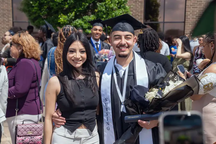 Graduates outside after commencement ceremony.