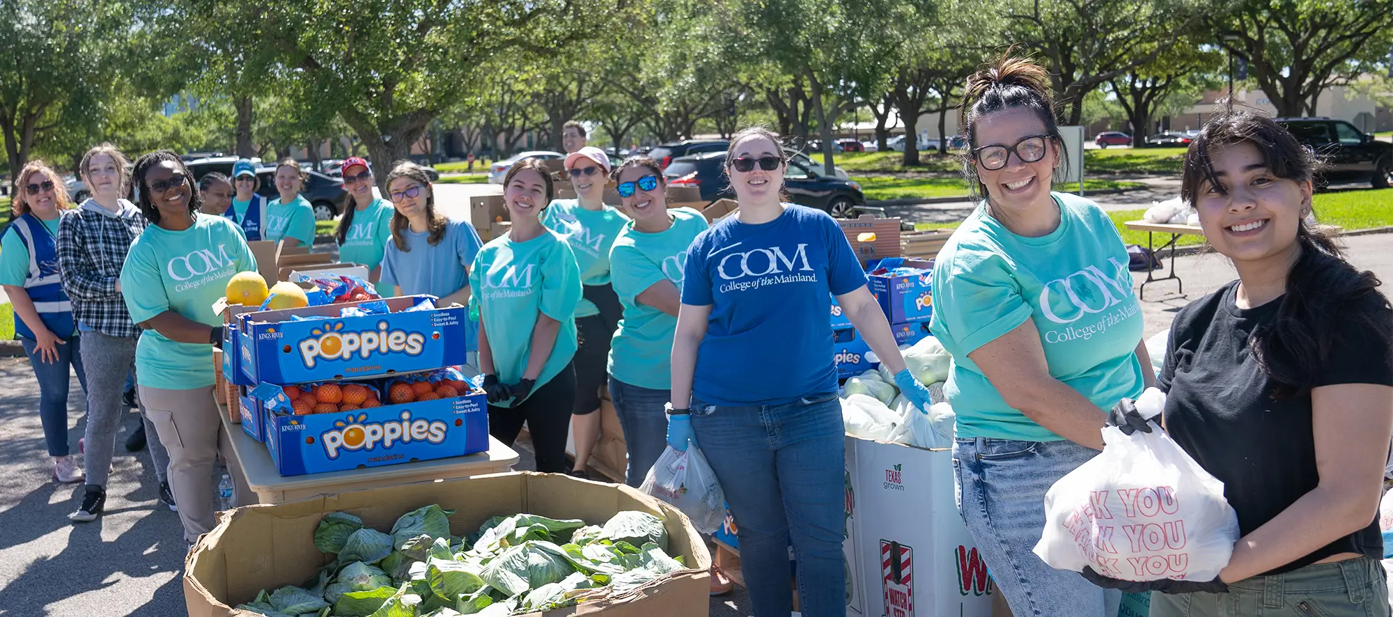 COM students helping with a food drive.