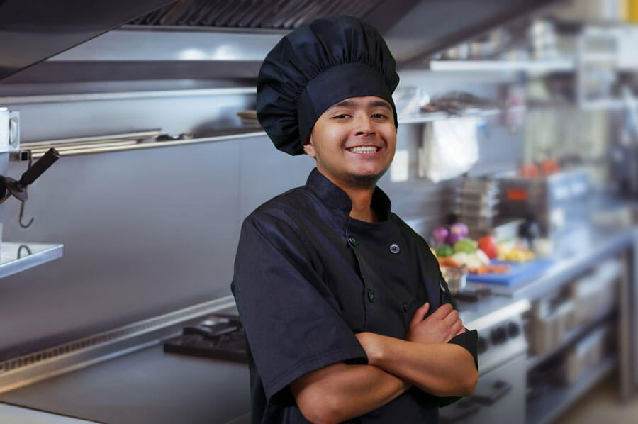 Young chef in professional kitchen