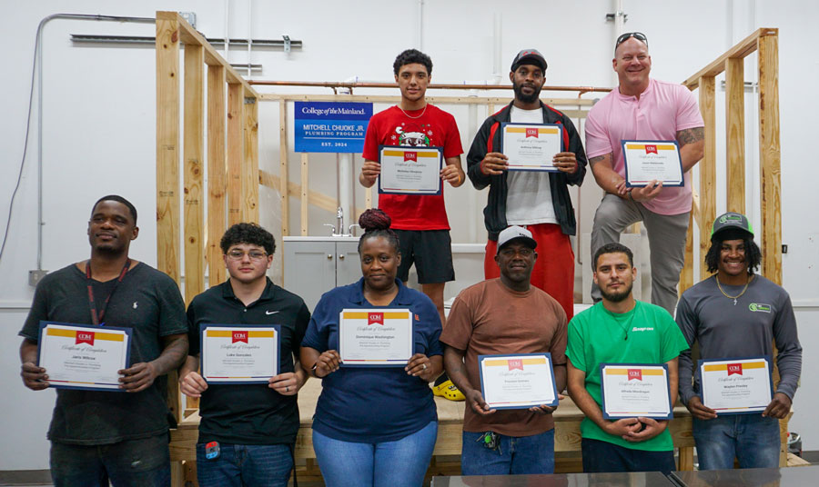 College of the Mainland’s First Graduating Cohort of the Mitchell Chuoke Jr. Plumbing Program Stands with Their Certificates