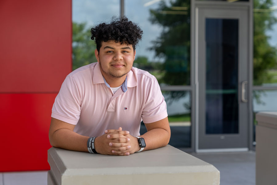 Student sitting outside of Steam Building