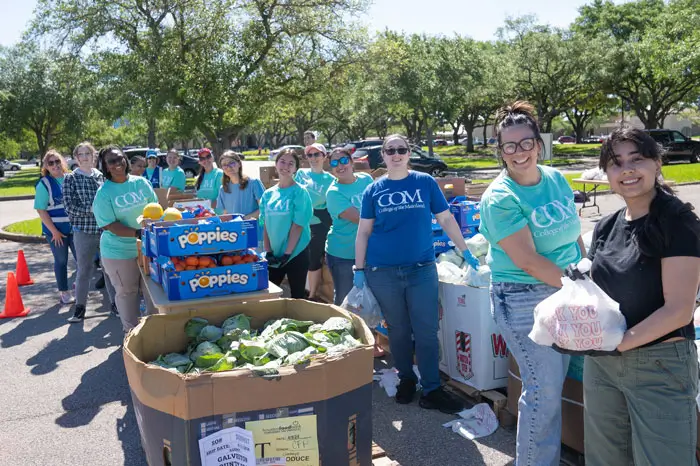 COM students helping with a food drive.