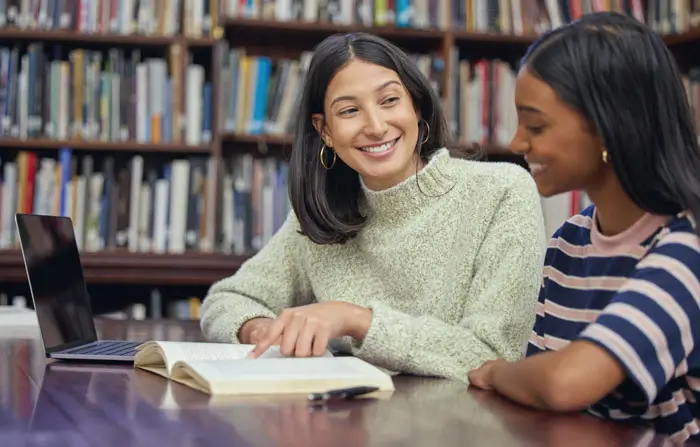 Student, tutor and university library with books